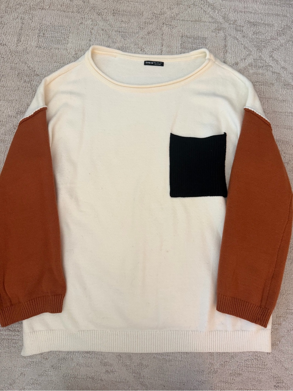 Women's Cream Sweater with Rust Sleeves and Black Pocket